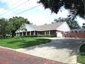 Brick home with a circular driveway at 2410 Nevada Rd, Lakeland, FL 33803