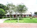 Brick home with a large front yard at 2410 Nevada Rd, Lakeland, FL 33803