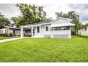 Quaint bungalow with green lawn at 422 E Belmar St, Lakeland, FL 33803