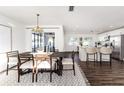 Open concept dining room with kitchen access and modern light fixture at 4618 Crestview Ln, Lakeland, FL 33813