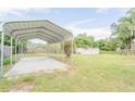 Metal carport and backyard area at 121 Coleman Rd, Winter Haven, FL 33880
