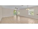 Spacious living room with tile floors and lots of natural light at 6838 Glenbrook Dr, Lakeland, FL 33811