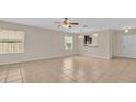 Living room with tile floors and access to back patio at 6838 Glenbrook Dr, Lakeland, FL 33811