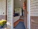 Inviting entryway with hardwood floors and glass block windows at 235 24Th Sw Ct, Winter Haven, FL 33880