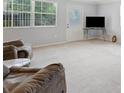 Spacious living room with neutral carpeting and ample natural light at 1015 E George St, Bartow, FL 33830