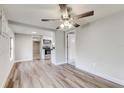 Bright living room with hardwood floors and ceiling fan at 2429 Lakeview St, Lakeland, FL 33801