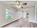 Bright bedroom with ceiling fan and hardwood flooring at 2429 Lakeview St, Lakeland, FL 33801