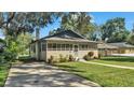 Updated bungalow with a screened porch and spacious yard at 1127 N Stella Ave, Lakeland, FL 33805