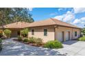 House exterior with a two-car garage and walkway at 3933 Mammoth Grove Rd, Lake Wales, FL 33898