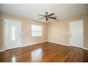 Living room with hardwood floors and ceiling fan at 3933 Strickland Ct, Lakeland, FL 33812