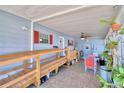 Covered patio with ramp access, ceiling fan, and small table and chairs at 5002 Lodgewood Dr, Lakeland, FL 33810