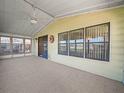 Carpeted screened porch with ceiling fan at 134 Lake Hazel Dr, Winter Haven, FL 33884