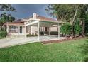Home exterior showcasing carport and well-manicured lawn at 1806 17Th Nw St, Winter Haven, FL 33881