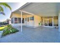 Covered patio of yellow single-wide manufactured home at 1742 Fox Hill Dr, Lakeland, FL 33810