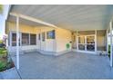 Covered patio of yellow single-wide manufactured home at 1742 Fox Hill Dr, Lakeland, FL 33810