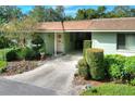 Light green building with carport and nicely landscaped front yard at 2203 Starboard Rd, Winter Haven, FL 33881
