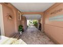 Brick paved driveway leading to a backyard with lush greenery at 308 Allamanda Dr, Lakeland, FL 33803