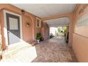 Covered carport with brick pavers at 308 Allamanda Dr, Lakeland, FL 33803