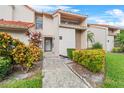 Front entrance of condo with landscaping at 1710 Garden Lake Dr # 1710, Winter Haven, FL 33884