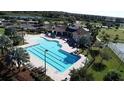 Community lap pool and leisure pool with clubhouse at 5514 Maggiore Blvd, Lakeland, FL 33805