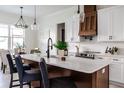 Modern kitchen with white shaker cabinets, quartz countertops, and a large island at 1001 Cody Bluffs Rd, Babson Park, FL 33827