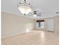 Simple living room with tile floors and ceiling fan at 618 Ridge Ter, Winter Haven, FL 33881