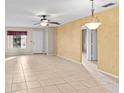 Bright living room with tile floors and ceiling fan at 618 Ridge Ter, Winter Haven, FL 33881