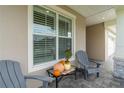 Cozy front porch with rocking chairs and fall decor at 7929 Lake James Blvd, Lakeland, FL 33810