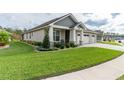 Landscaped front yard with lush green grass at 7929 Lake James Blvd, Lakeland, FL 33810