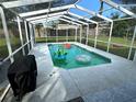 Relaxing screened pool with patio area, perfect for outdoor entertaining at 750 Azalea Dr, Bartow, FL 33830