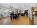Open concept dining area with table and chairs, adjacent to living room and kitchen at 855 Candyce Ave, Lakeland, FL 33815
