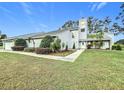 Two-story house with attached garage and landscaped yard at 92 Wood Hall Dr, Mulberry, FL 33860