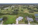 House with large yard and view of surrounding area at 92 Wood Hall Dr, Mulberry, FL 33860