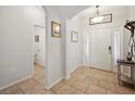 Bright entryway with tile flooring and access to half bathroom at 1849 Charleston Ln, Bartow, FL 33830