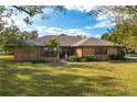 Ranch style brick home with a nicely landscaped yard at 24 Lake Ave, Winter Haven, FL 33880