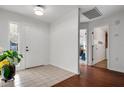 Spacious entryway with tile and wood flooring, and views into other rooms at 6250 Sandpipers Dr, Lakeland, FL 33809