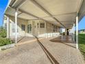 Covered carport providing shade and parking for the manufactured home at 6461 Hollyberry Ne Ln, Winter Haven, FL 33881