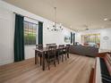 Bright dining area with a table for six and views into the living room at 4511 Micanope Crescent Dr, Lakeland, FL 33811