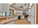 Kitchen with wood cabinets, and a view of the living room at 4616 Musket Dr, Lakeland, FL 33810