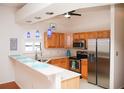 Modern kitchen with stainless steel appliances and breakfast bar at 6064 Condor Dr, Lakeland, FL 33809