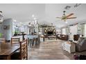 Open concept living area with a kitchen and vaulted ceiling at 6155 Bethlehem Rd, Mulberry, FL 33860