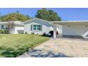 Front view of a single story home with carport at 718 Barber Cir # 718, Lakeland, FL 33803