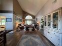 Spacious living room with high ceilings, hardwood floors, and large windows at 737 Butternut Pl, Lakeland, FL 33813