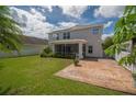 Large backyard, screened patio, and stamped concrete patio at 7018 Cascades Ct, Lakeland, FL 33813
