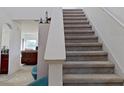 Indoor view of carpeted staircase leading to the second floor at 2199 Ontario Way, Lakeland, FL 33805