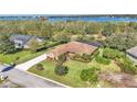 House with a pool and backyard overlooking the water at 3206 Heron Cv, Winter Haven, FL 33884