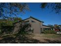 Two-story house, brown siding, green trim at 3597 Raintree Ln, Lakeland, FL 33803