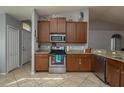 Kitchen with stainless steel appliances and granite countertops at 5791 Woodruff Way, Lakeland, FL 33812