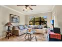 Spacious living room featuring a comfortable sectional sofa and large windows at 904 Charo Pkwy # 517, Davenport, FL 33897