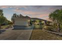 Single-story home with a two-car garage and landscaped yard at 7525 Jessamine Dr, Lakeland, FL 33810